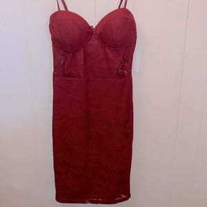 Brand new lace fitted cranberry dress. With built in cups and slip. Size small.